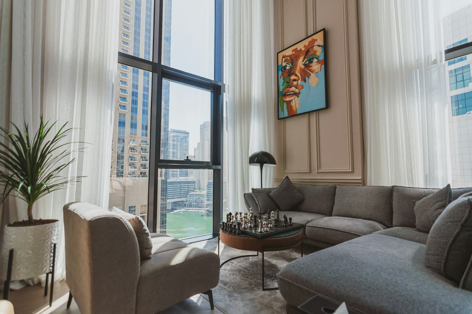 A living room filled with furniture and a large window